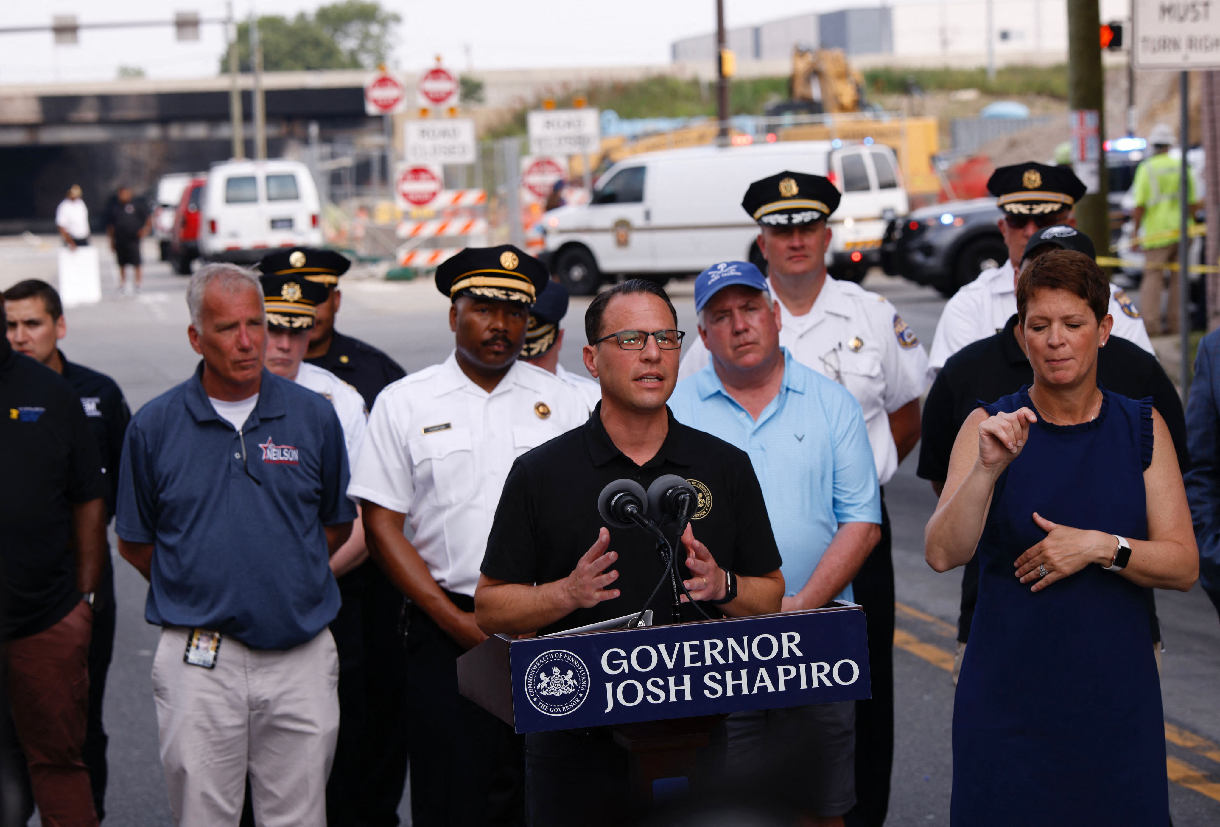 Gov. Josh Shapiro speaks to members of the media near a collapsed portion of Interstate 95 on June 11, 2023.